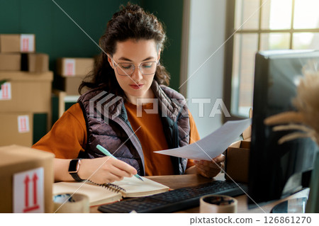 Woman working in a warehouse 126861270