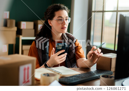 Woman working in a warehouse 126861271