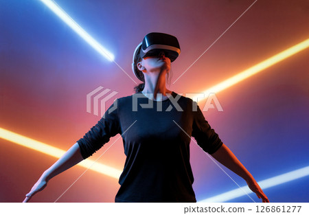 Woman with VR virtual reality goggles 126861277