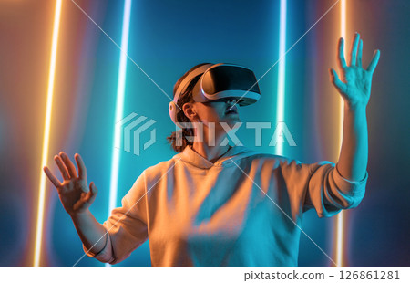 Woman with VR virtual reality goggles 126861281
