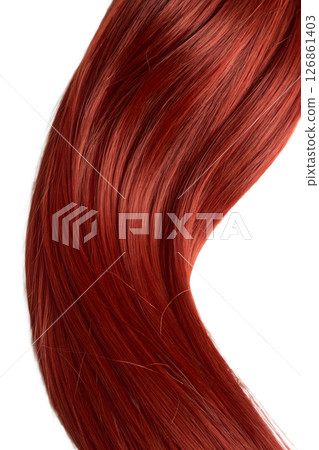 Close-up of a single fiery red hair strand detailed texture, warm tones, beauty and genetics concept 126861403