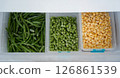Frozen green beans, peas, and corn preserving freshness in refrigerator 126861539