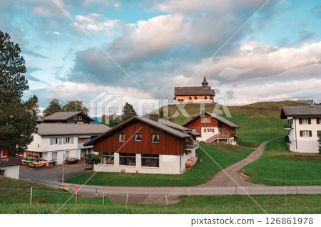 Scenic alpine village with Stoos chapel on hill at Switzerland 126861978