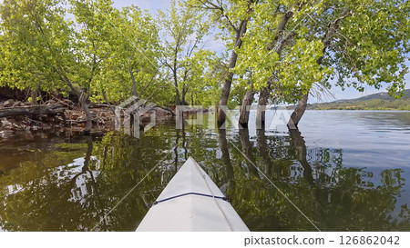 spring kayaking or canoeing on Horsetooth Reservoir at foothills of Rocky Mountains near Fort Collins, Colorado - POV paddler perspective spring kayaking or canoeing on Horsetooth Reservoir at foothills of Rocky Mountains near Fort Collins, Colorado - POV paddler perspective 126862042