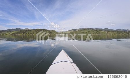spring kayaking or canoeing on Horsetooth Reservoir at foothills of Rocky Mountains near Fort Collins, Colorado - POV paddler perspective 126862046