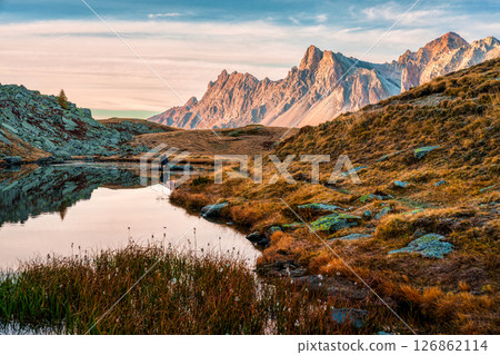 Sunrise over Massif des cerces reflect on Lac Long in Claree Valley at France 126862114