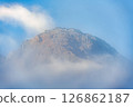 Mountain peak with blue sky and wispy cloud 126862187