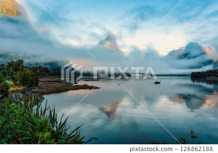 Landscape of Milford Sound with Mitre peak in foggy on the lake during the morning at New Zealand 126862188