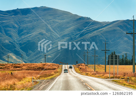 Road trip with car driving on the road during autumn and mountain background at New Zealand 126862195