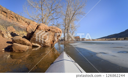 winter kayaking or canoeing on Horsetooth Reservoir near Fort Collins, Colorado - POV paddler perspective 126862244