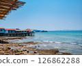 Fishing village built on tropical sea and ferry boat by the dock in summer at Koh Larn island 126862288