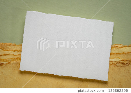 small blank sheet of watercolor paper on a tan toned paper small blank sheet of watercolor paper on a tan toned paper 126862296