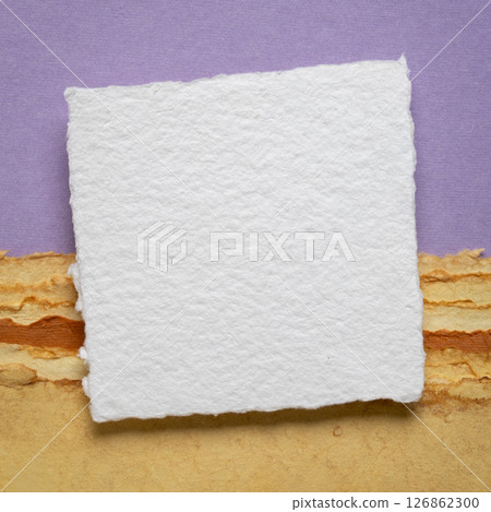 small blank sheet of watercolor paper on a tan toned paper small blank sheet of watercolor paper on a tan toned paper 126862300