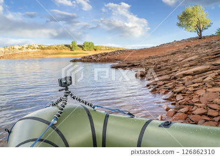 Packraft with action camera on a mountain lake in Colorado Packraft with action camera on a mountain lake in Colorado 126862310