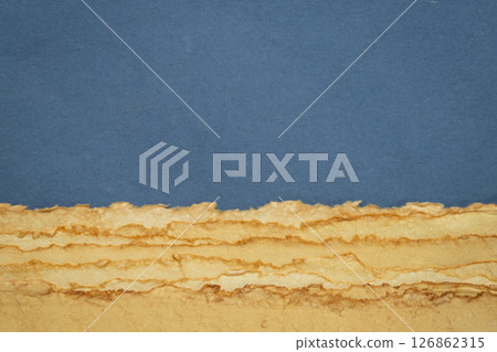 abstract desert landscape created with sheets of textured colorful handmade paper abstract desert landscape created with sheets of textured colorful handmade paper 126862315