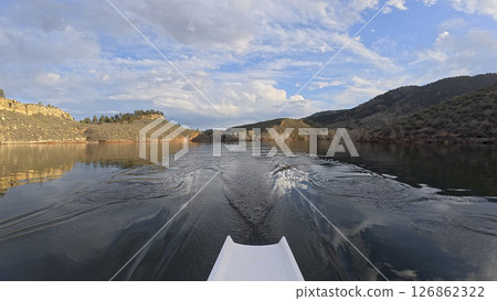 rowing on calm water of sandstone canyon of Horsetooth reservoir in Colorado - POV rower perspective rowing on calm water of sandstone canyon of Horsetooth reservoir in Colorado - POV rower perspective 126862322