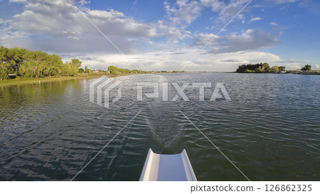 summer rowing on Boyd Lake in Colorado - POV rower perspective 126862325