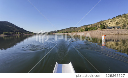morning rowing on calm water of Horsetooth reservoir in Colorado - POV rower perspective morning rowing on calm water of Horsetooth reservoir in Colorado - POV rower perspective 126862327