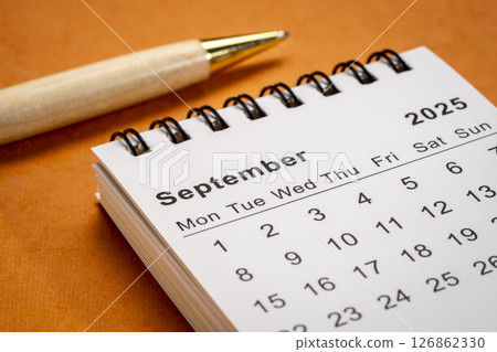 September 2025 - small spiral desktop calendar, time and business concept September 2025 - small spiral desktop calendar, time and business concept 126862330