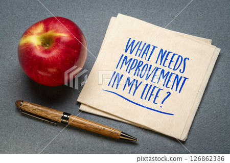 What needs improvement in my life? A motivational question on napkin. Personal development concept. 126862386