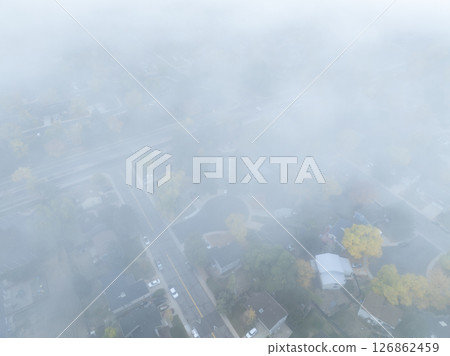 foggy October sunrise over residential street in  Fort Collins in northern Colorado 126862459