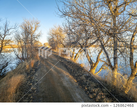 bike path at Roulard Lake near Severance, Colorado in winter scenery - Great Western Bike Trail, rails to trails conversion project bike path at Roulard Lake near Severance, Colorado in winter scenery - Great Western Bike Trail, rails to trails conversion project 126862468