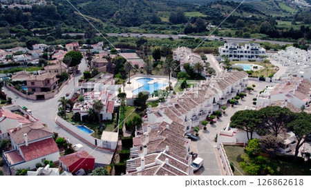 Aerial view of architecturally-designed modern prestige homes with pools in outer suburban Spain 126862618