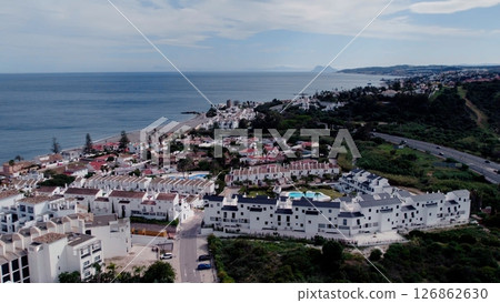 Aerial view of architecturally-designed modern prestige homes with pools in outer suburban Spain 126862630