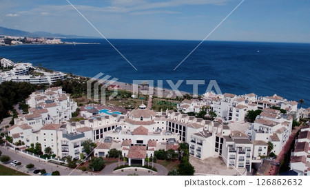 Aerial view of architecturally-designed modern prestige homes with pools in outer suburban Spain 126862632