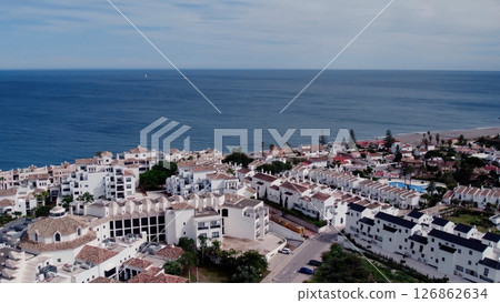 Aerial view of architecturally-designed modern prestige homes with pools in outer suburban Spain 126862634
