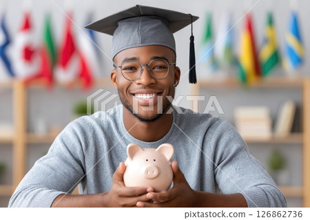 Male Graduate with Piggy Bank and Glasses 126862736