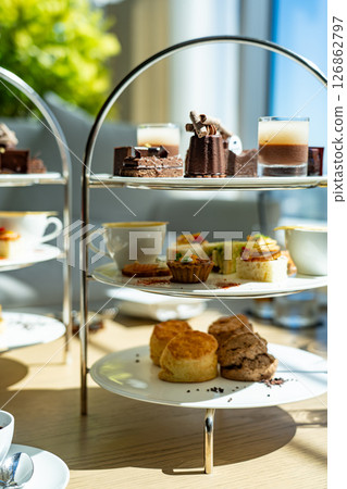 Three-tiered afternoon tea stand 126862797