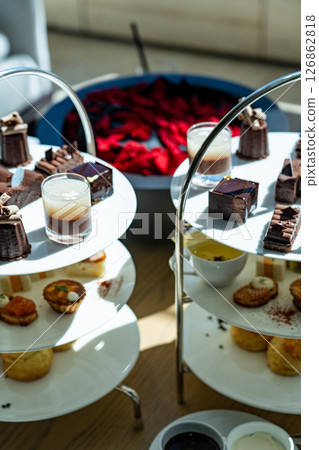 Three-tiered chocolate and baked goods tea set 126862818