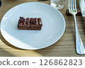 Chocolate cake on a white plate 126862823