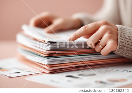Professional Hands Organizing Business Documents and Reports 126862843