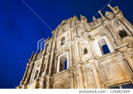 Night view of the ruins of St. Paul's Cathedral at Jesus Company Square in Macau, China, is a historic architectural landmark, and a UNESCO World Heritage. Night view of the ruins of St. Paul's Cathedral at Jesus Company Square in Macau, China, is a historic architectural landmark, and a UNESCO World Heritage. 126862884