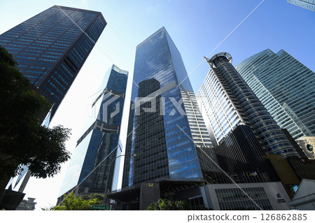 Low-angle building view of the modern office skyscrapers in the financial district of Raffles Place, Singapore. Low-angle building view of the modern office skyscrapers in the financial district of Raffles Place, Singapore. 126862885