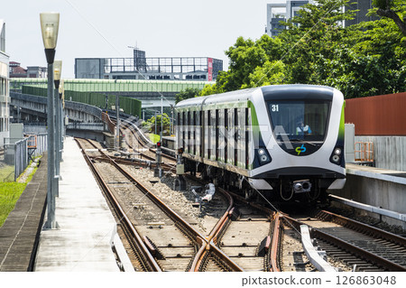 A Green Line train running on the elevated track of the Taichung Rapid Transit System in Taiwan.  A Green Line train running on the elevated track of the Taichung Rapid Transit System in Taiwan.  126863048