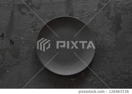 Empty black slate plate on dark stone table. Food background for menu, recipe 126863536