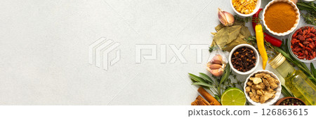 A wide selection of cooking spices and herbs on a gray background, perfect for adding depth to any dish, top view and copy space, banner A wide selection of cooking spices and herbs on a gray background, perfect for adding depth to any dish, top view and copy space, banner 126863615