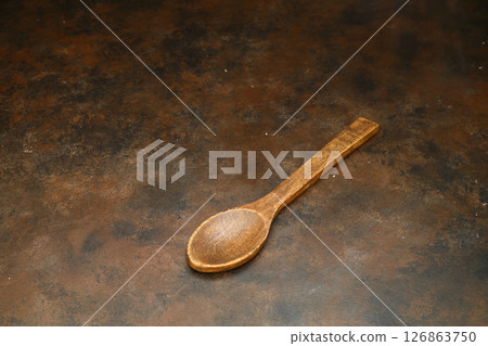 old empty spoons on wooden background old empty spoons on wooden background 126863750