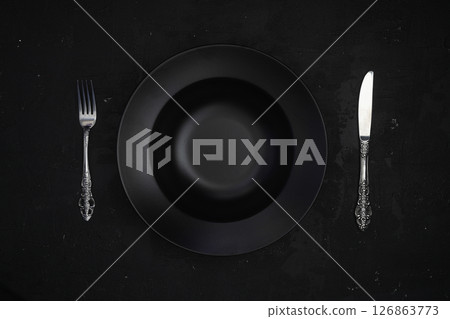 Empty black slate plate on stone table. Flatlay, top view. Mockup for restaurant dish 126863773