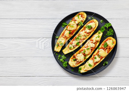 stuffed zucchini boats filled with bolognese sauce 126863947