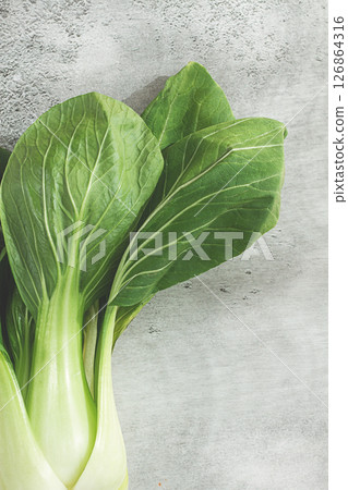 Fresh bok choy, close-up, on a light gray surface, top view, natural light, Fresh bok choy, close-up, on a light gray surface, top view, natural light, 126864316