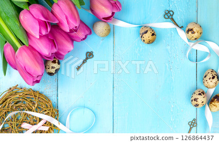 Spring background. Bouquet of flowers on a wooden background and a nest with eggs. spring Spring background. Bouquet of flowers on a wooden background and a nest with eggs. spring 126864437