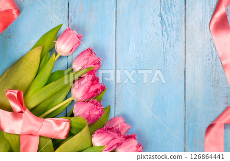 Bouquet of tulips on blue wooden table. Happy women's day. 8 March., Mother's Day. Bouquet of tulips on blue wooden table. Happy women's day. 8 March., Mother's Day. 126864441