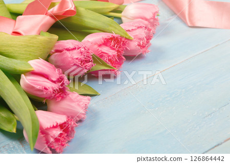 Bouquet of tulips on blue wooden table. Happy women's day. 8 March., Mother's Day. Flat lay and copy space 126864442