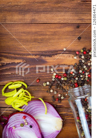 DIFFERENT SPICES FOR COOKING FOOD ON A DARK WOODEN BACKGROUND DIFFERENT SPICES FOR COOKING FOOD ON A DARK WOODEN BACKGROUND 126864471
