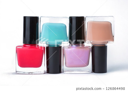 varnishes for nails different colors on a white background varnishes for nails different colors on a white background 126864498