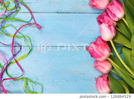 tulips on a blue background. the photo is stylized into a drawing tulips on a blue background. the photo is stylized into a drawing 126864529